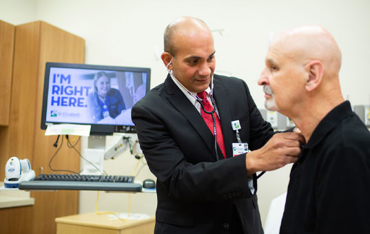 Doctor examines a patient in a medical facility