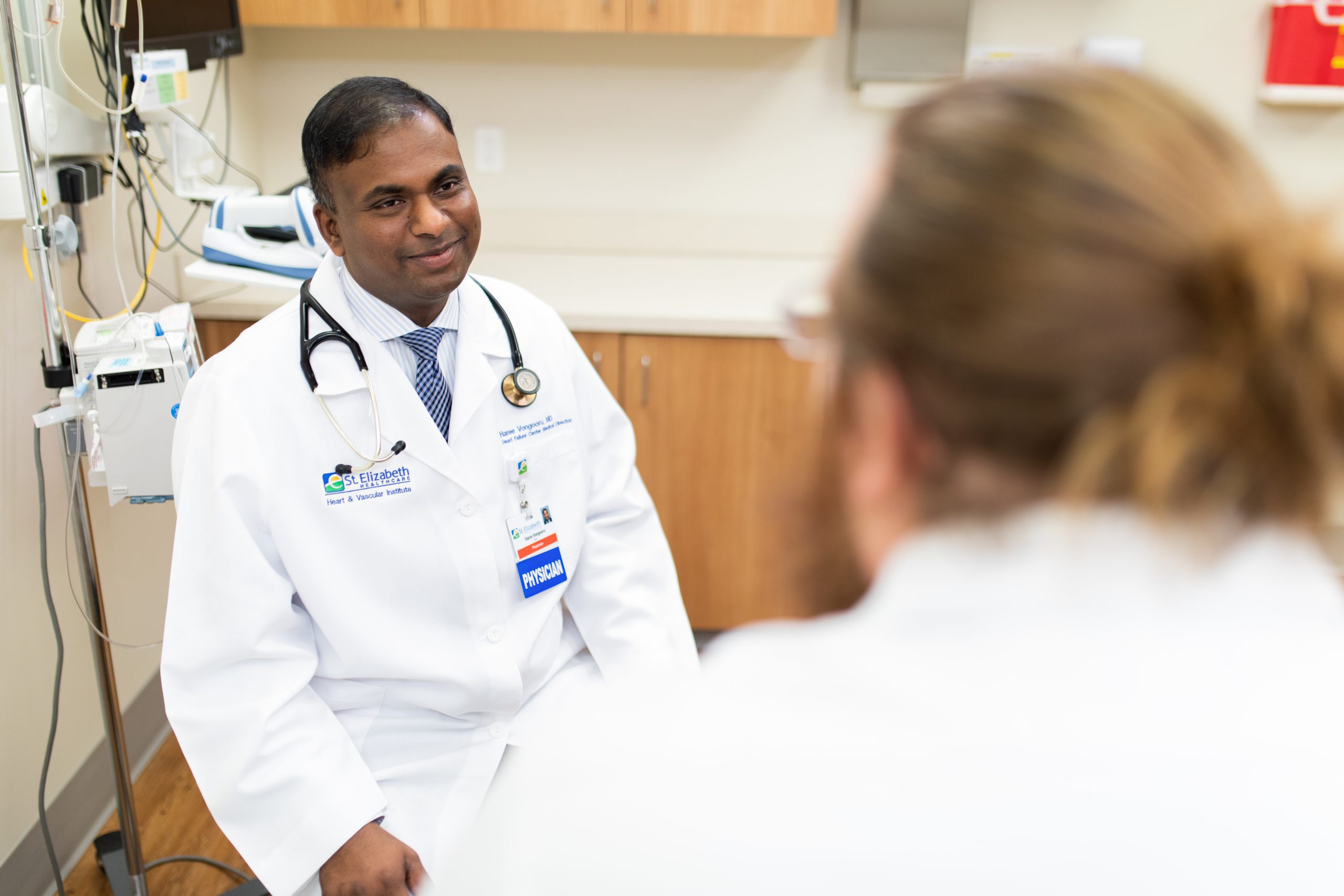 Doctor speaks with patient in medical office