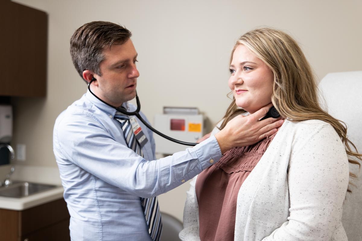 Dr. Benjamin Peterson with a patient.